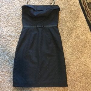 Black eyelet strapless dress.